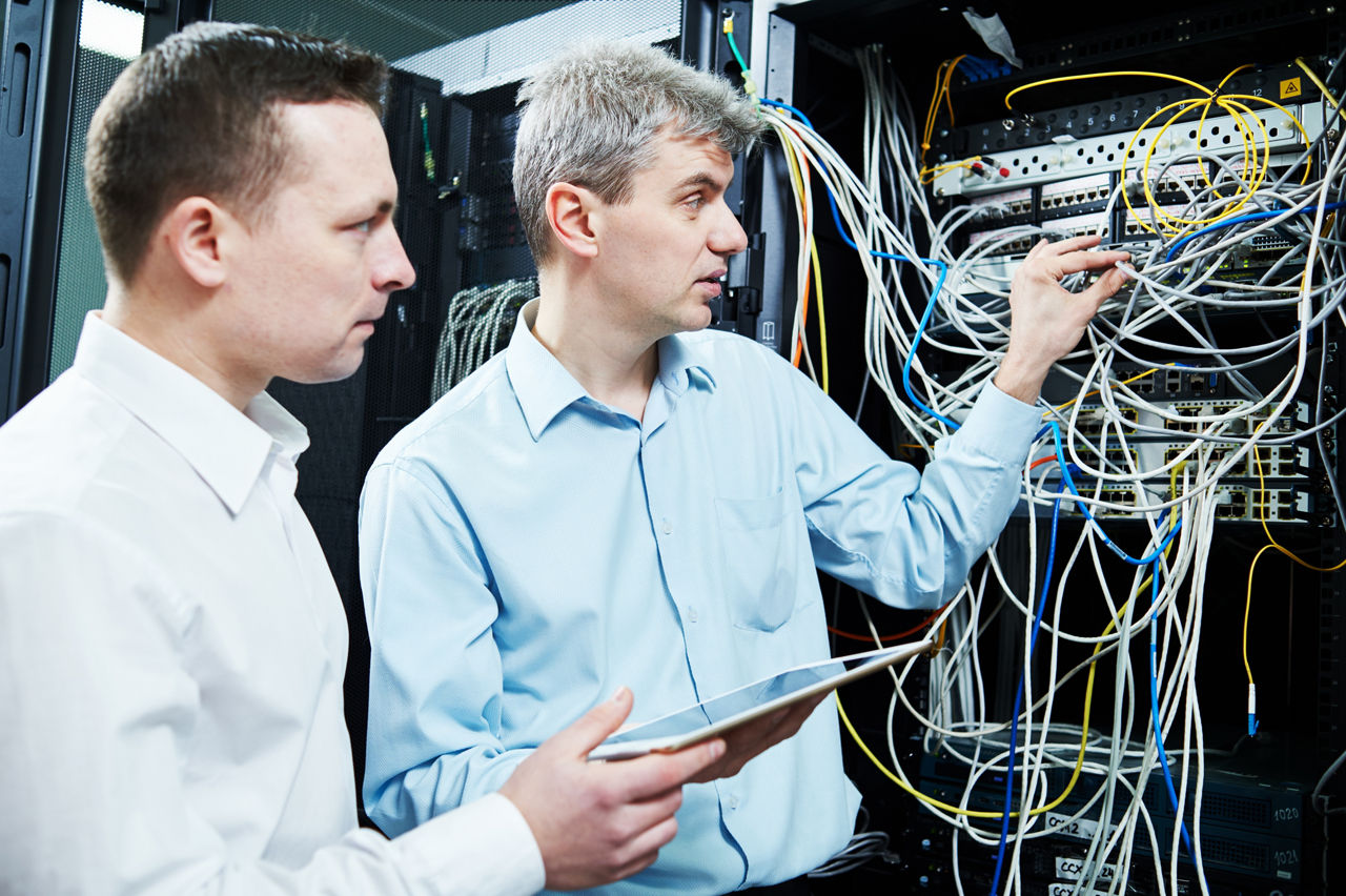 Network administrators working in the data center