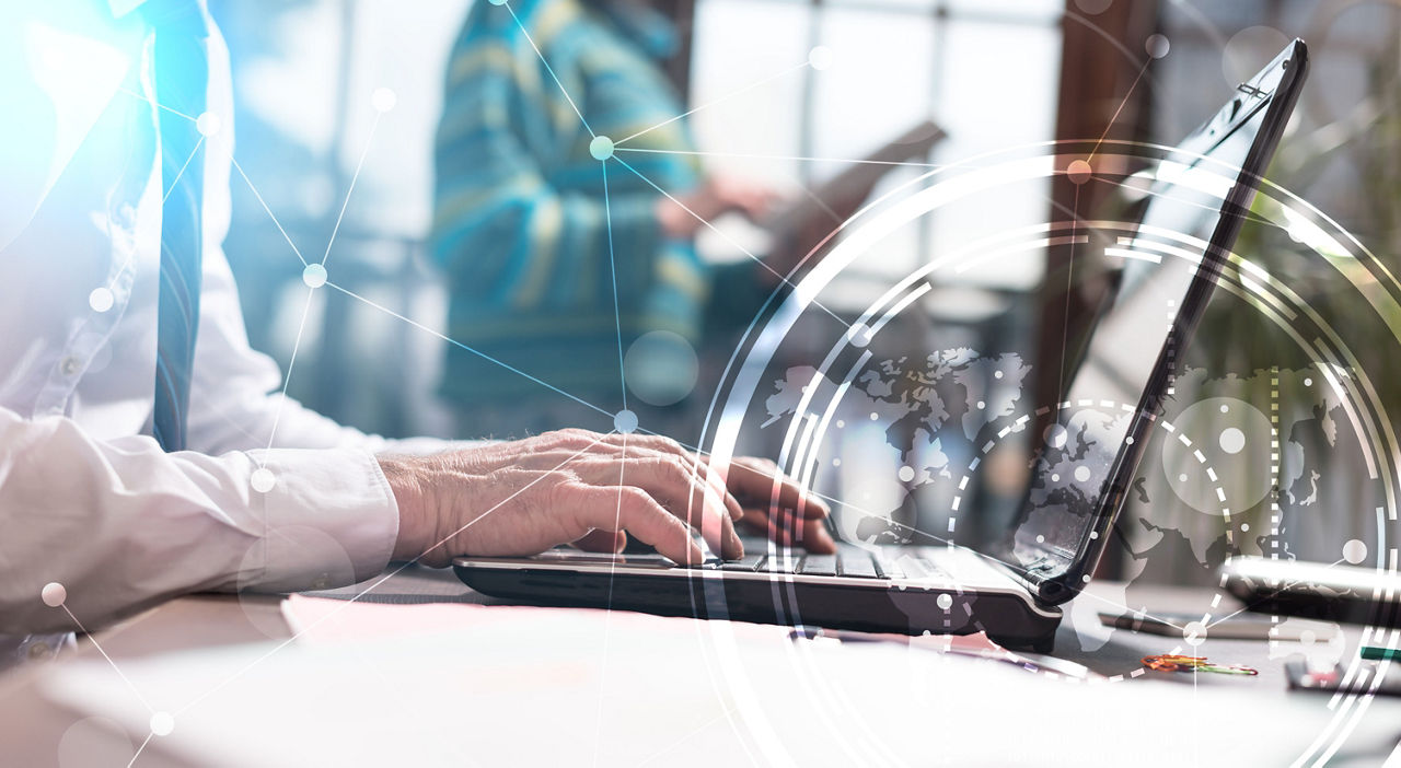 Software support specialist working on a laptop