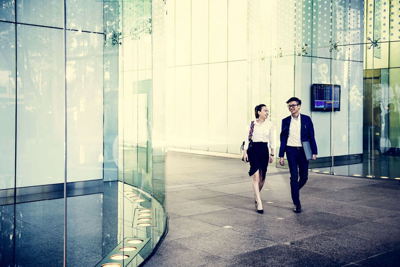 Business people discussing while walking together