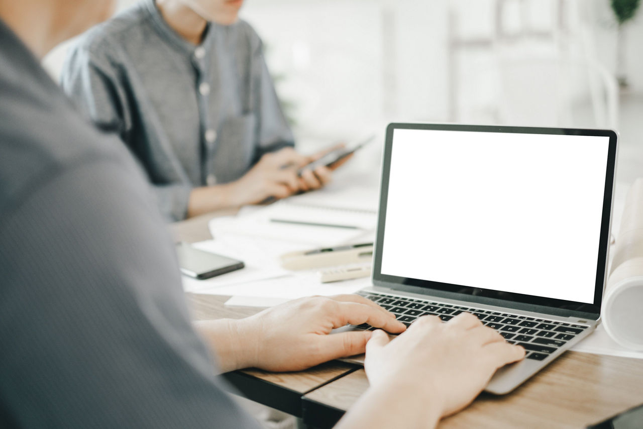 Mockup image of engineers using laptop to drawing design building Project in office, mockup concept