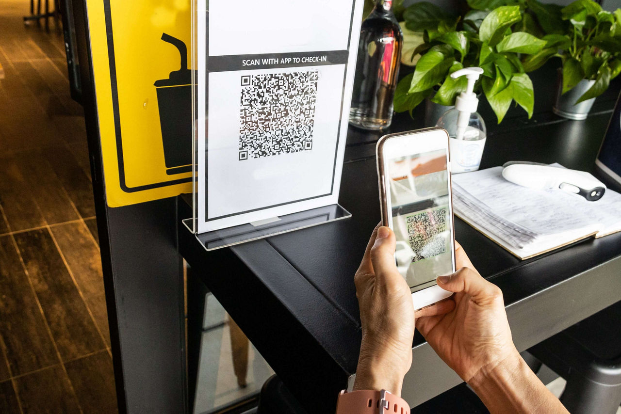 Modified inactive QR Code used.  Person scanning QR code with smartphone to register details before enter outlet to comply with contact tracing rule 