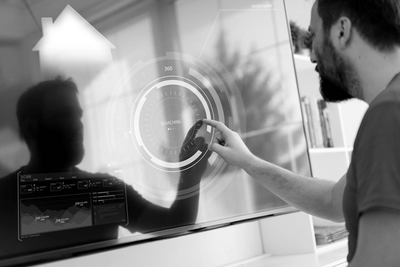 Individual looking and pointing on a digital screen