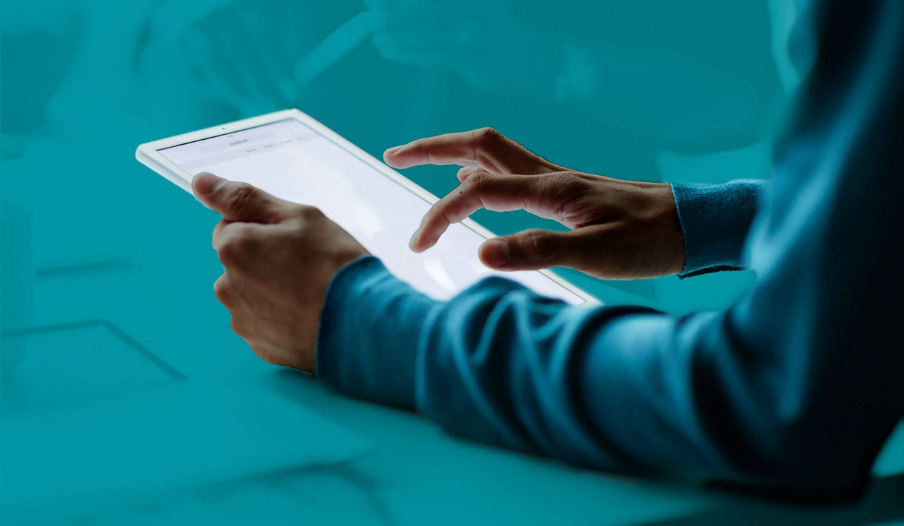 Hands using a tablet