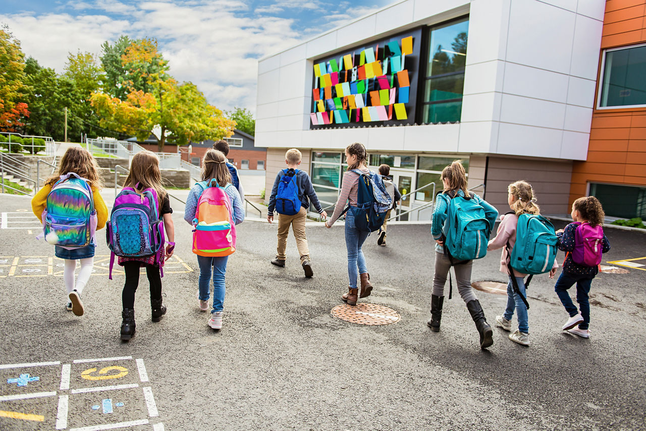 group of kids go to the school, Back view
