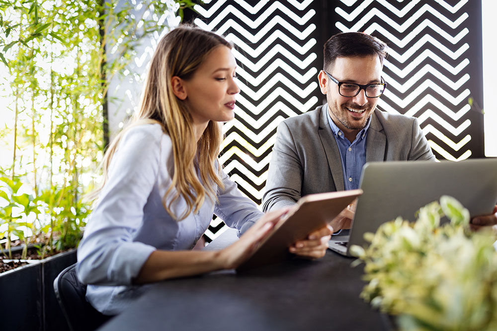 Two business colleagues at meeting in modern office interior