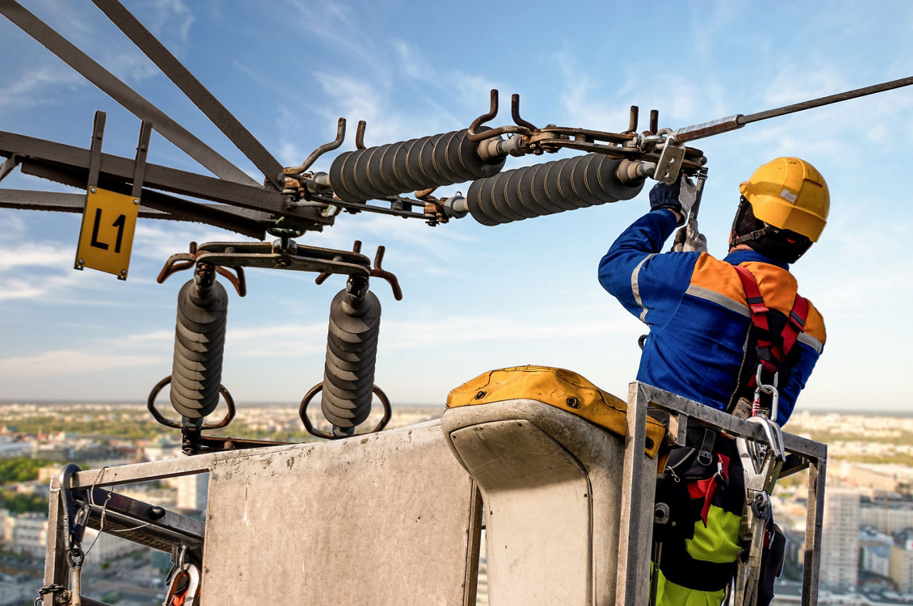 Electrical engineer repairing the electrical network on an elevation boom